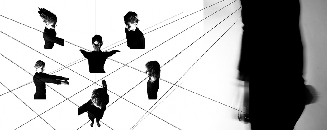 czarno-biała grafika przedstawiająca czarne linie w perspektywie na białym tle oraz wycięte fragmenty czarnych sylwetek ustawionych miedzy liniami